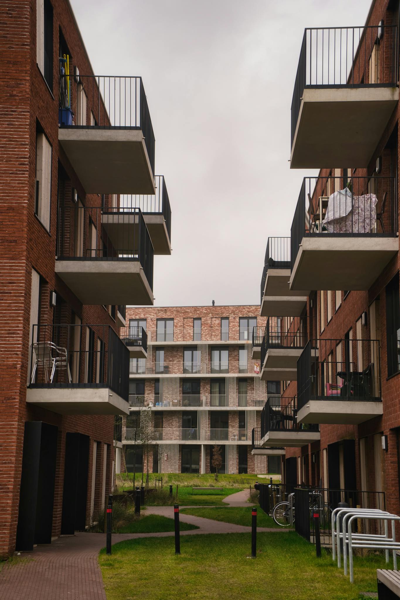 A view of modern apartment buildings with balconies, showcasing urban residential architecture.